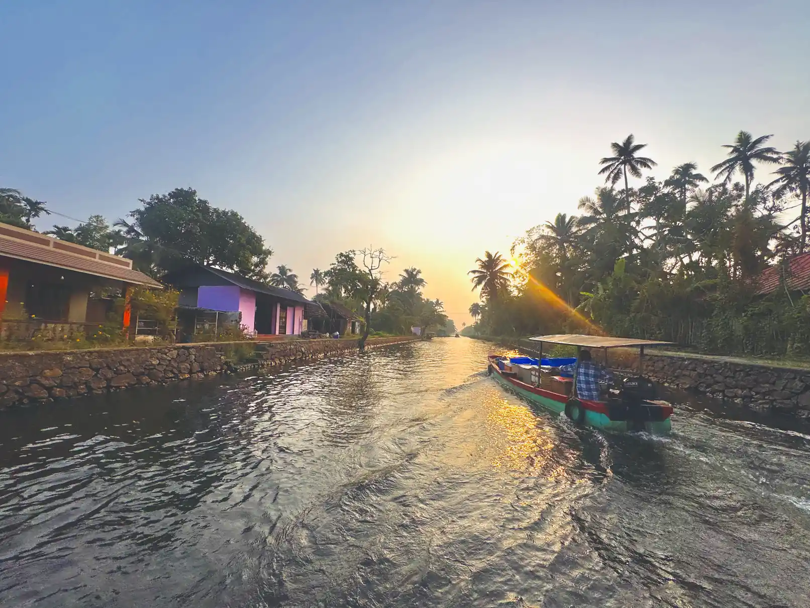 Golden-hour sunset boat ride in Alleppey